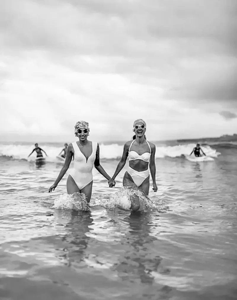 Two Girls Holding Hands In Surf, 1992